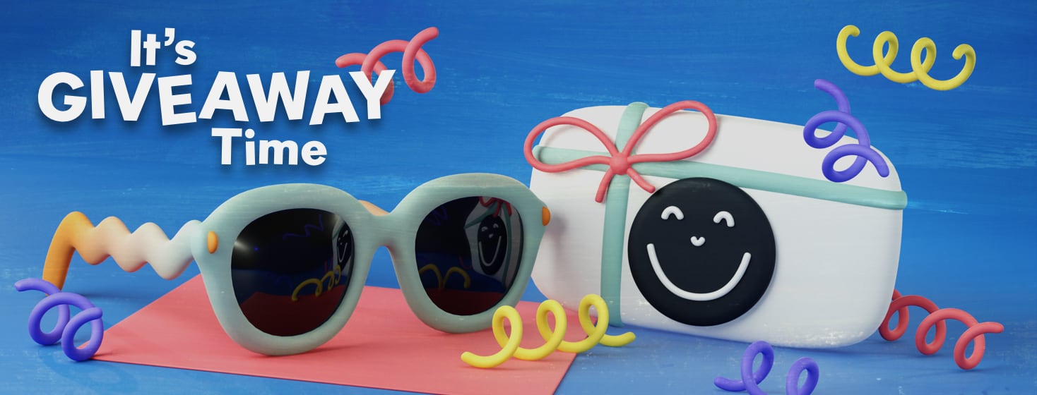 A funky looking pair of sunglasses sit next to a black and white gift card with a smiley face on it. There is confetti strewn about the scene.