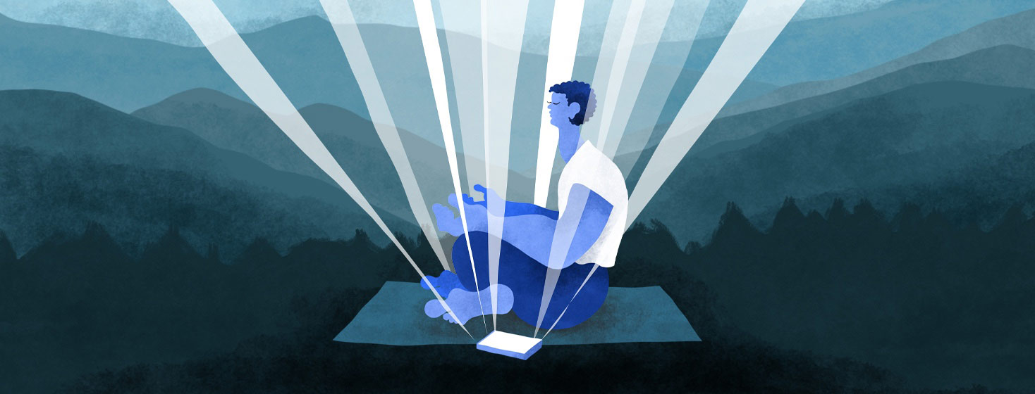 A person is sitting crosslegged and has their eyes closed. They are meditating in the mountains with an app steaming light from their phone.