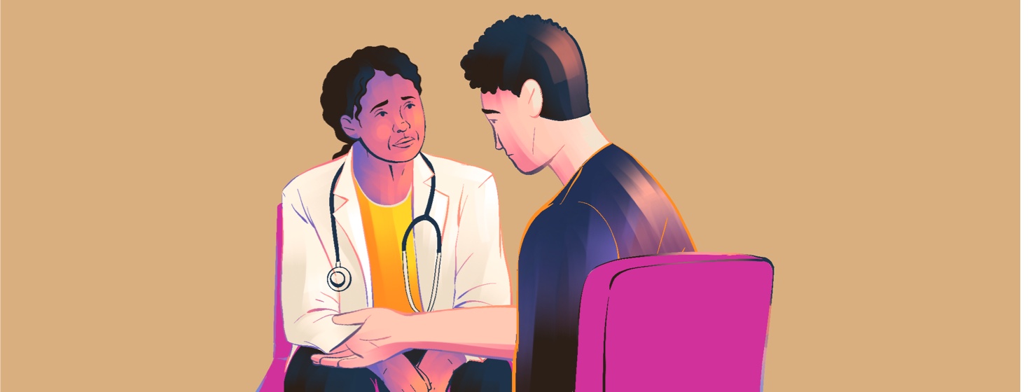 A concerned doctor listens to an anxious man